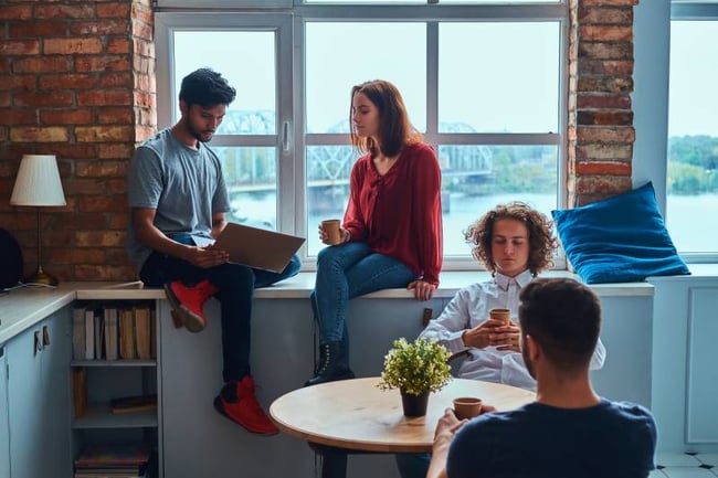 Students chatting in shared apartment