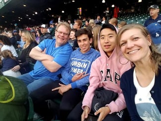 Host family at baseball game