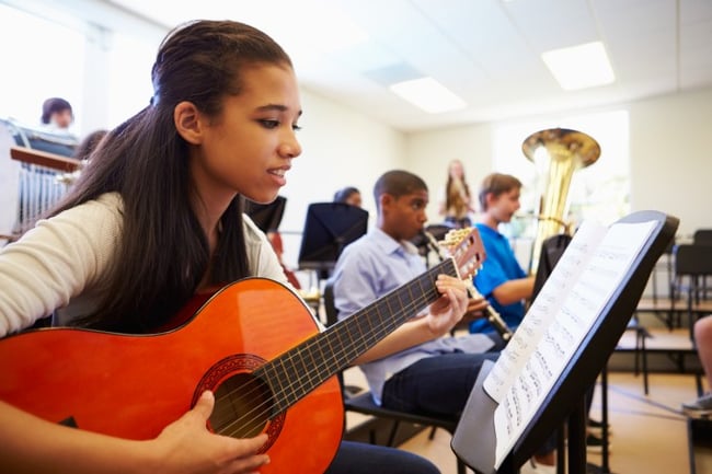 Student playing guitar