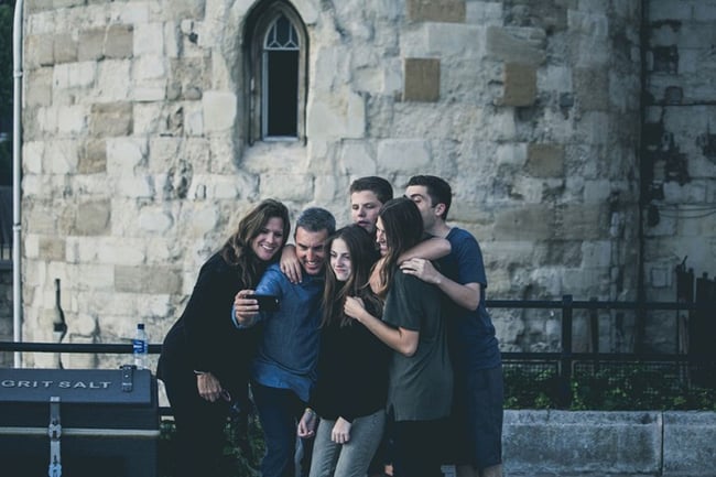 Host family taking selfie together