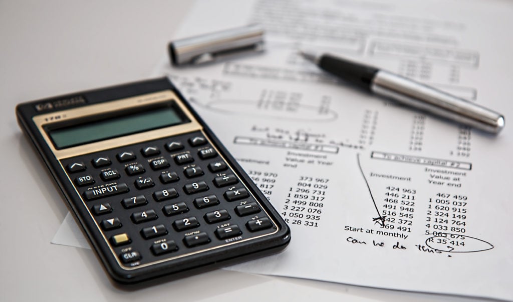 Calculator and balance sheet calculating costs