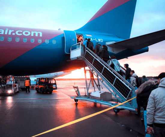 Passengers getting on airplane