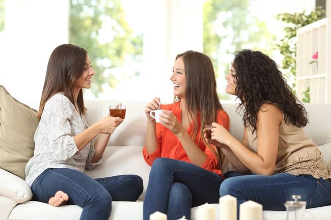 Students drinking coffee in their shared apartment 