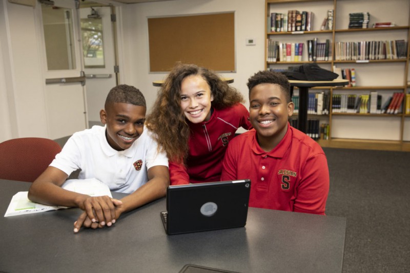 Three exchange students working together