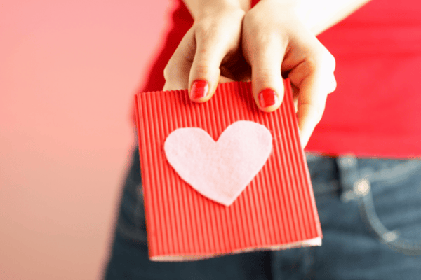 Woman gifting a valentines day card