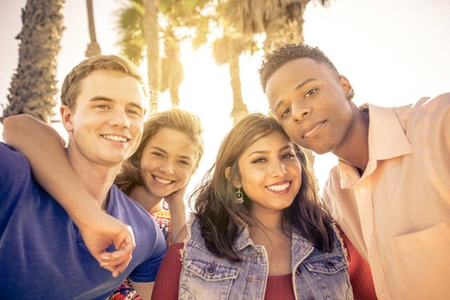 students posing together at the beach in LA