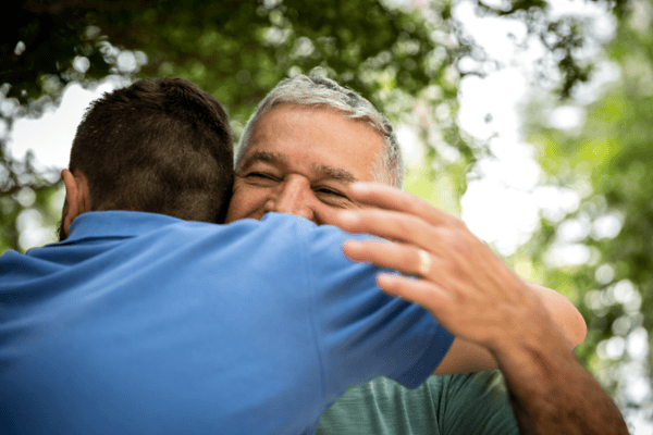 host dad hugging international student-1