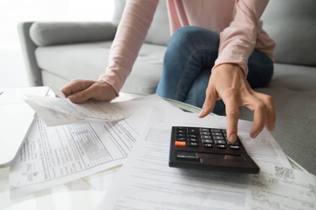 student reviewing her bills 