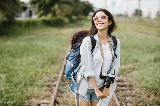 student travelling with her backpack