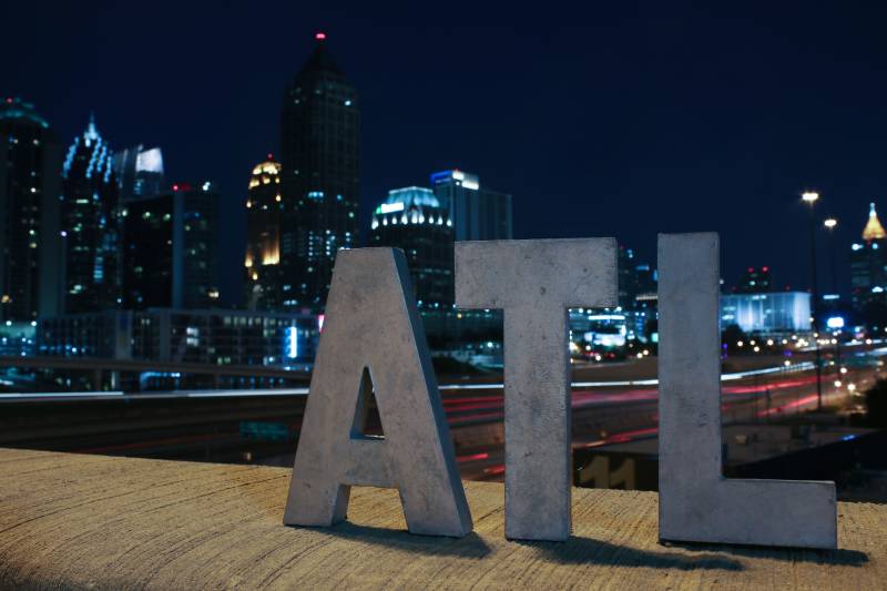 ATL sign overlooking Atlanta at night